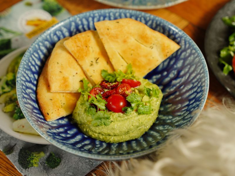 Chipotle chicken grain bowl with guacamole and salsa
